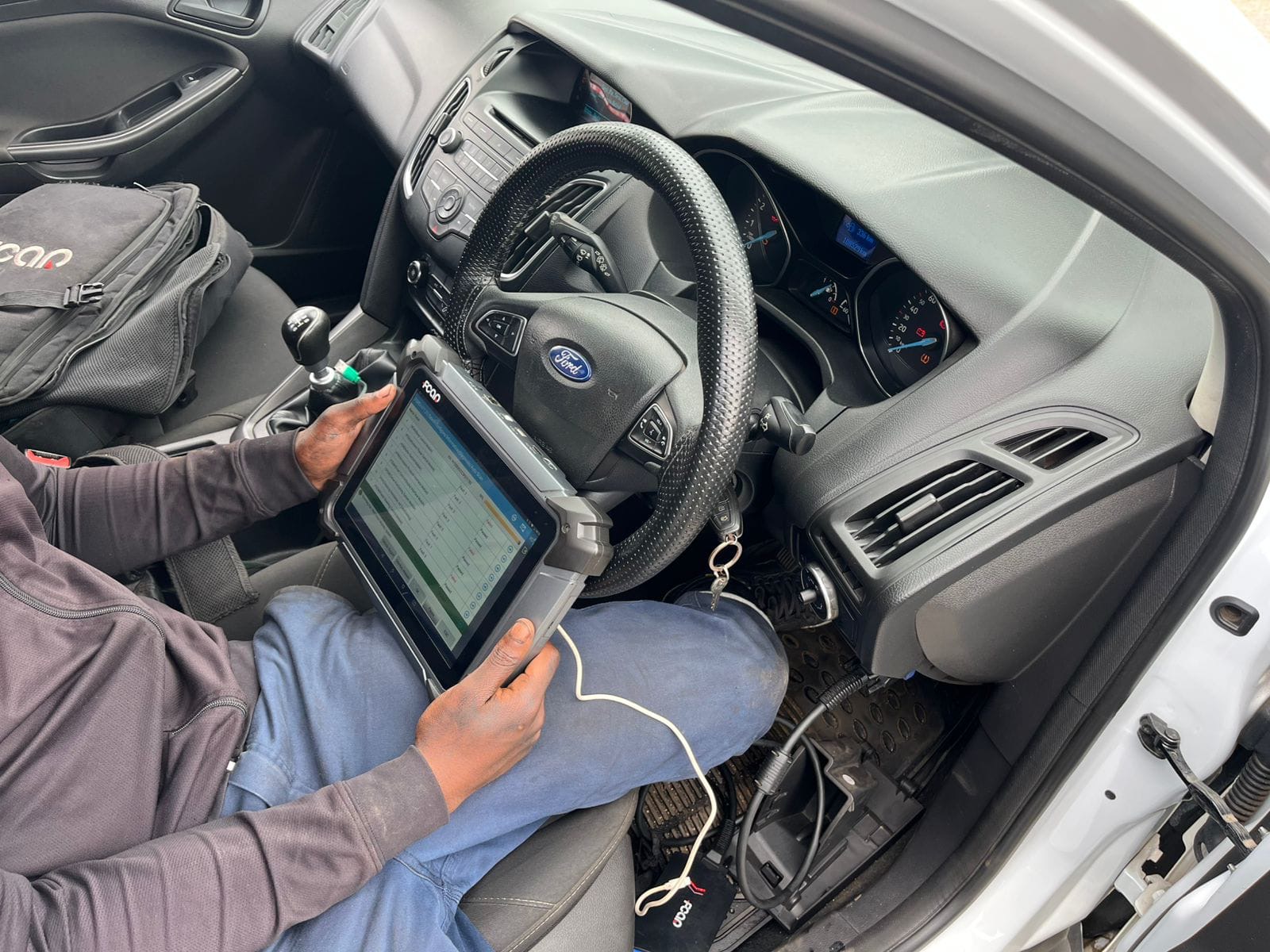 Diagnostic scan being run inside a vehicle